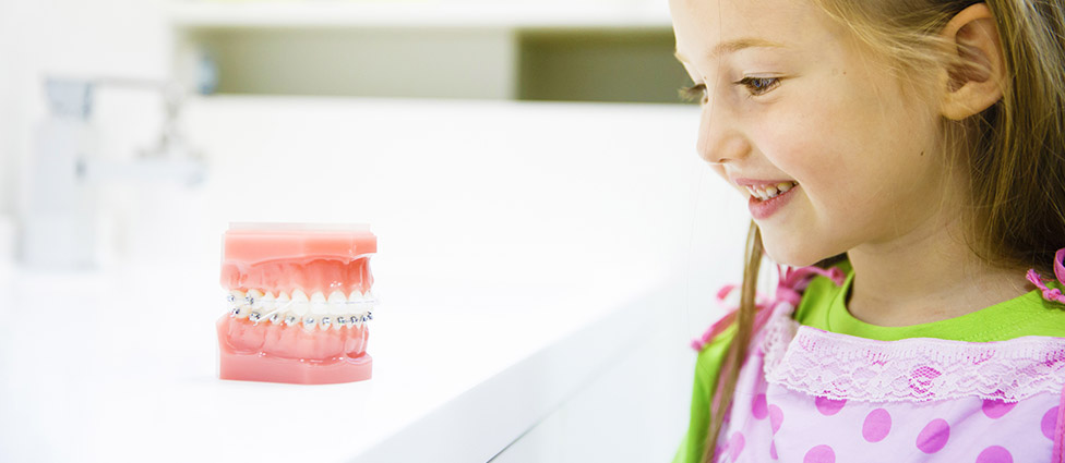 Young child learning about braces